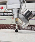 Waterjet AC-5AXIS cutting head upgrade with 0-70° large-angle nozzle, mounted on metal gantry.