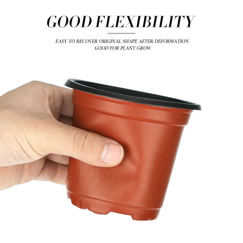Hand holding 100 Pack Red 4 Inch Plastic Plant Pots For Seed Starting And Seedlings Lightweight Reusable Nursery Pots With Drainage Holes
