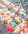 Nine Colorful Plastic Tatting Shuttles Set for Lace DIY Hand Lacemaking Craft displayed on textured floral fabric