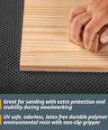 Hand sanding wood on Heavy Duty Non Slip Mat For Workshop And Workbench 24 By 48 Inch Grippy Anti Slip Grip Pad