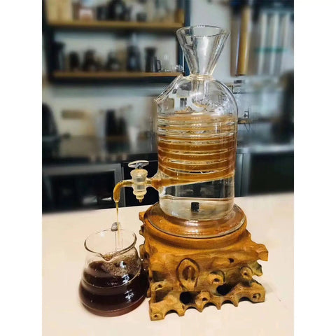 Premium Glass Ice Drip Coffee Maker For Next Level Cold Brew Delivery And Lightning Fast Drink Chilling serves up brewed coffee in a glass carafe.