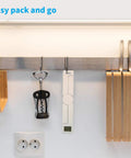 On The Go Portable Food Scale Folding Digital Kitchen Scale for Travel and Diet hanging next to a corkscrew in a kitchen