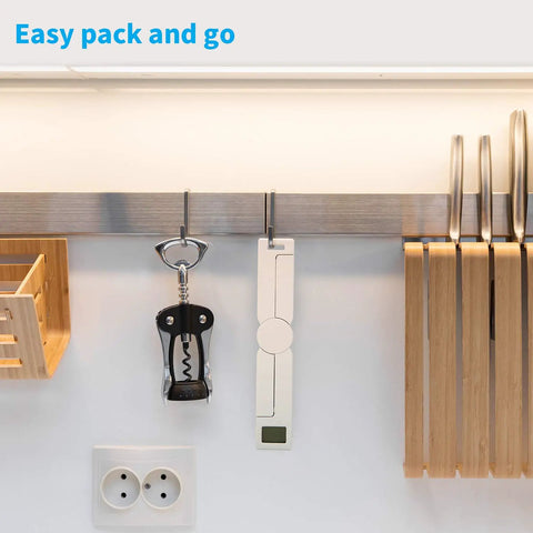 On The Go Portable Food Scale Folding Digital Kitchen Scale for Travel and Diet hanging next to a corkscrew in a kitchen