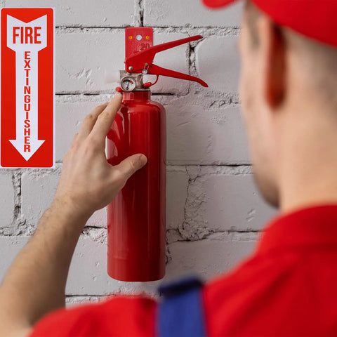 Person installing 2 Pack Fire Extinguisher Holder And 4 Sign Stickers on a brick wall, heavy duty mount for 5 to 20 lb extinguishers