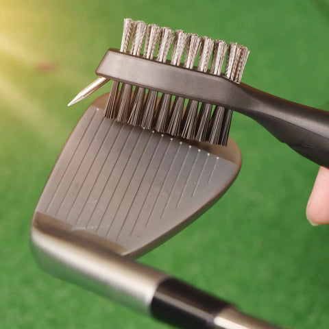 Three In One Golf Gear Kit With Microfiber Waffle Towel Clip, Golf Club Brush Groove Cleaner And Divot Tool With Marker For Men And Women Ideal Gift For Golfers Of All Levels And Ages showing brush cleaning club.