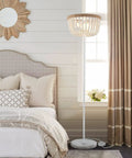 Boho Floor Lamp With White Wood Beaded Shade For Bedroom Living Room And Girl Room Three Light Bulb Fixture Cozy Warm Glow Durable Rustic Modern Decor next to bed in cozy room.