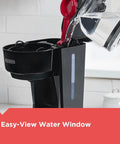 12 Cup Coffee Maker With Vortex Technology And Sneak A Cup Pause No Mess Pour Easy On Off Switch Non Drip Carafe in use