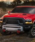Red Ram truck with front tow hook mounting brackets, three-quarter inch D-ring for 2010-2020 models, off-road ready.
