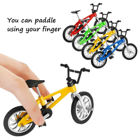 Hand holding yellow bike from 12 Pack Mini Finger BMX Bikes For Kids And Adults, Reconfigurable Tiny Bicycle Toys, Vintage Color Mix.