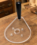 Score Your Shop Upgrade With This Six By Nine Inch Clear Acrylic Router Base Plate Built Straight For Makita Compact Models Featuring Pre Drilled Mounting Holes And Three Eighth Inch Thickness For Rock Solid Precision Woodworking, showing clear acrylic design with grip handle.