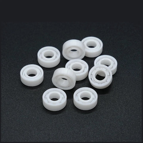 Front view of white MR115 5x11x4 mm full-ceramic bearing with zirconia ceramic balls