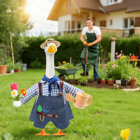 Totally Cute Porch Goose Gardener Outfit Kit For A 23 Inch Goose Statue with hat, apron, scarf, watering can, and flower pot; garden setting with man gardening in background.