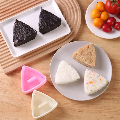 Triangle Rice Ball Molds 2 Pack Large Do It Yourself Sushi Makers Kit For Lunch Bento Easy Rice Ball Mold With Paddle on table