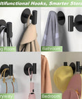 Self-Adhesive Rust-Resistant Stainless Steel Coat Hooks Heavy-Duty No-Drill Wall Hangers for Towels Robes Coats Hats Black 2 Pack in living room, bathroom, entryway, and bedroom settings