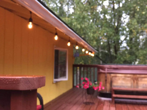 Patio with string lights using 11W Outdoor S14 Incandescent Replacement Bulbs For Patio String Lights E26 Base 25 Pack 120V Clear Amber Tint