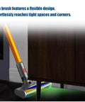 Soft Roller Laser Brush Head for V12 Detect Slim and V10 Slim Green LED Light Motorhead in use under furniture.