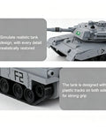 Ultra Realistic 1 To 48 Scale RC Tank Toy Inspired By M1 Abrams With Sand Exterior Authentic Markings And Precise Turret Details Plus Full Function Remote Control For Indoor And Outdoor Battle Play showing turret close-up.