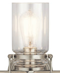Close-up of clear glass shade on Brinley 24-Inch Three-Light Vanity Light In Brushed Nickel With Farmhouse Chic design