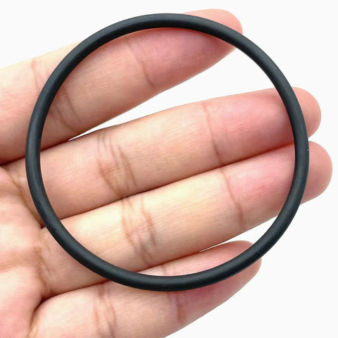 Hand holding Engine Camshaft Adjuster Magnet Seal 52X3 mm WHT007212B for VW Audi models, black rubber