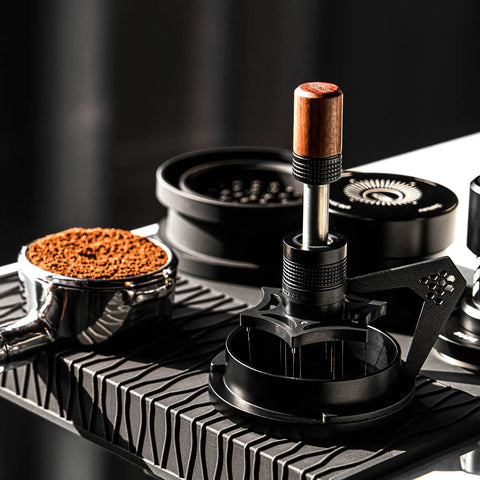 Hella Smooth 58mm Wdt Distribution Tool For Espresso Bars featuring ten adjustable needles on a black base with walnut grip.