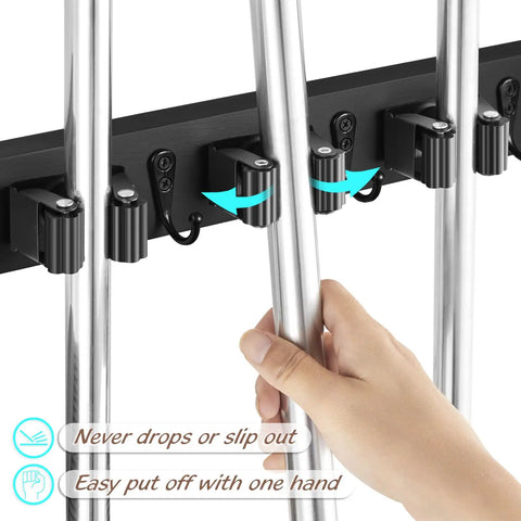 Wall Mount Mop And Broom Holder With Four Slots And Four Hooks For Quick Easy Gear Organization In Pantry Closet And Laundry Room Heavy Duty Black Rustic Wood Tool Organizer For Indoor Or Outdoor Use, hand placing mop