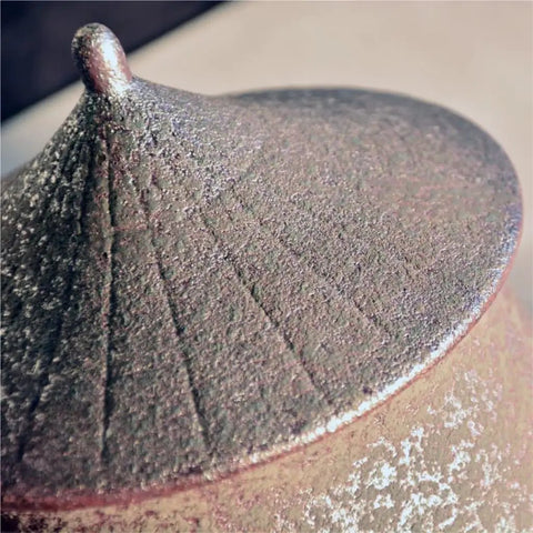Close-up of the lid of a Retro Styled Sealed Ceramic Jar For Loose Tea And Coffee Beans showing textured finish and design.