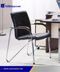 Office chair next to a desk, showcasing Cosmostar furniture in a modern workspace.