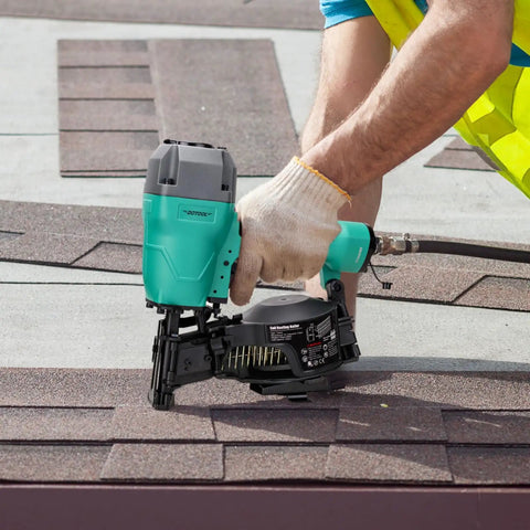 Person using CN45C 15 Degree Roofing Nailer Pneumatic Coil Nailer for shingles on rooftop, showing 120 nail capacity.