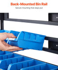 Hand placing blue bin on Seven Tier Double Sided Rolling Bin Storage Rack With Ninety Four Plastic Bins On Wheels Dual Sided Parts Organizer