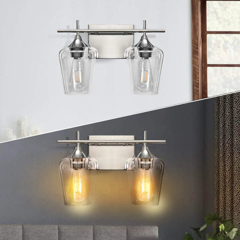Two Light Chrome Vanity Light Fixtures With Clear Glass Shade For Over Mirror Bathroom Lighting shown in day and night settings