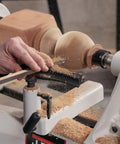 Carving wood on Heavy Workhorse 18X40 Electronic Variable Speed Woodworking Lathe 2HP 230V Reversible Turning Machine With Remote Emergency Stop And Improved Quill Lock Built Ready To Rock.