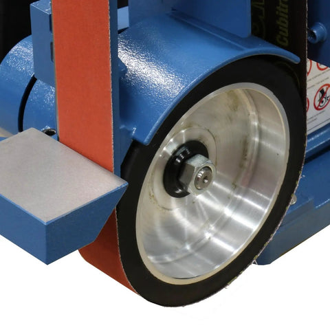 Close-up of Badass 2 X 48 Two Wheel Belt Grinder showing contact wheel and sander belt for metal crafting jobs.