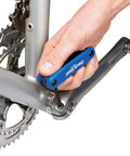 Hand using Fold Up Hex Wrench Set With 1.5mm Through 6mm Hex Keys Crafted From Industrial Tool Steel on bicycle crank arm.