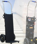 Rock Solid 1200W Electric Stair Climber Hand Truck With Folding Frame for Heavy Dumps on stairway background.