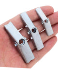 Hand holding steel pieces from Heavy Duty Toggle Bolt And Wing Nut Kit For Drywall Walls 48 Piece Set Tough As Nails Easy Install Wall Anchors