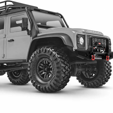 Rockin Metal Electric RC Winch For Mini 1/18 Trx4m And 1/24 Fms Crawlers mounted on a crawler truck front bumper with large tires.