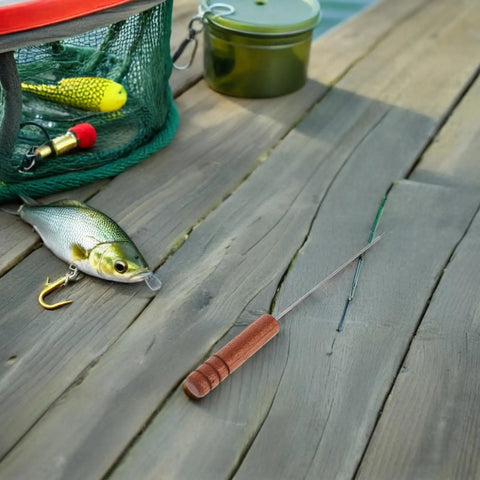 3-Piece Stainless Steel Baiting Needle Rigging Tool Set With Comfortable Rosewood Grip For Carp And Saltwater Fishing Effortless Worm Threading Precise Baiting And Versatile Lure Needle For Quick Rigging. Stainless steel baiting needle with rosewood handle beside fishing lures on deck