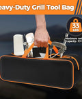 Person holding a Large Capacity Grill Utensil Storage Bag For Outdoor Grilling Holds Long Utensils Up To 23 Inches with tools inside.