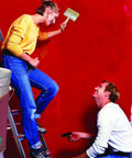 Couple painting wall red with Six Inch Deck Stain Brush With Wooden Handle For Wide Surface Staining On Decks Fences And Furniture