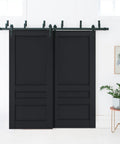 Top Shelf Rock Solid Sliding Closet Doors 72x96 Inches Barn Bypass Antracite Finish With Full Hardware Kit For Bedroom Room Divider Setup And Wall Mounting, two sliding black barn doors in a room.
