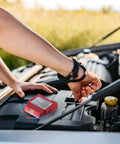 Road Ready Vehicle Fire Extinguisher And Aerosol Fire Suppression Kit With Adhesive Backing For Cars Trucks ATVs And Boats shown mounted in vehicle engine compartment.
