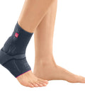 Side view of knit ankle support for men and women with achilles brace and compressive foot wrap, silver color, worn on foot