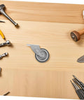 Premium Barn Door Floor Guide Roller Slider Kit With Ridiculously Slick Caster Wheels and Quick Fit Mounting Screws on wood surface.