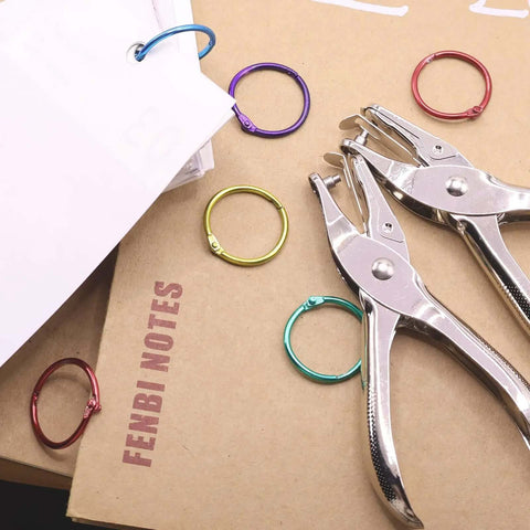 Dual Hole Punch Set With One Quarter Inch And One Eighth Inch Holes, Handy Single Hole Punch displayed with colorful rings for DIY crafts