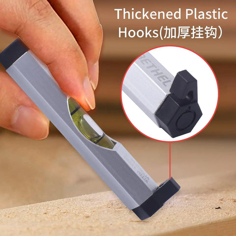 Close-up of Legit 3 Pack Aluminum Bubble Line Level String Tool with thickened plastic hooks in use on a wooden surface.