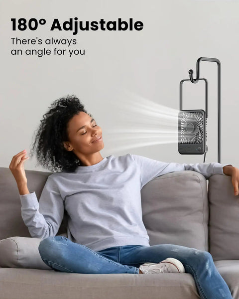 USB Desk Fan With Dope 7 Blade Design High Airflow Yet Ultra Quiet Personal Cooler 180 Degree Tilt shown on a sofa-side table