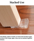Clear Plastic Shim Wedges 8 Pack for Leveling Tables and Furniture stacked under wooden leg on wooden floor