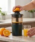 Asixxsix Portable Electric Citrus Juicer In Dark Green 400ml Cordless Handheld Fruit Press Machine, juicing an orange with fresh juice.