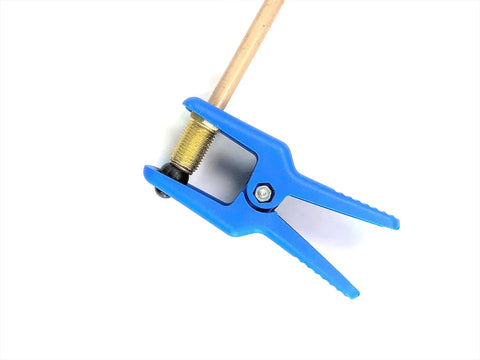 Close-up of the Leak-Proof Fluid Line Stopper Kit For Brake, Fuel, Transmission And Power Steering Lines, blue gripping tool on tubing