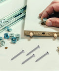 Hand assembling furniture with screws and connectors, part of 50 Sets Drywall Anchors And Screws Expansion Tubes Kit With Stainless Steel And Plastic